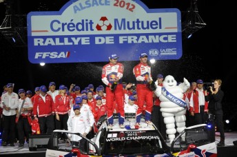 Sebastien Loeb (right) with co-driver Daniel Elena after winning their home rally last year