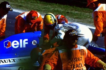 Senna helps Erik Comas from his stricken Ligier