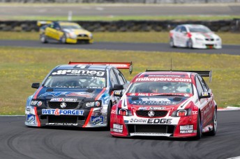 Greg Murphy holds the inside line over Simon Evans at Manfeild. Pic: Andrew Bright