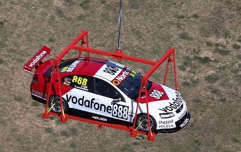 The Lowndes/Luff Commodore was helicoptered onto Mount Panorama today