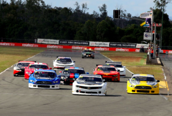 The TA2 Racing Australia field heads to Turn 1 at Queensland Raceway 