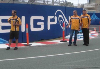 Phil Keed (left), Alain Menu and Jason Bright at the new BigPond Hairpin during their track walk yesterday