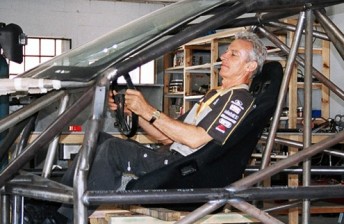 Peter Brock sitting inside the car that he was meant to drive in the Dakar Rally