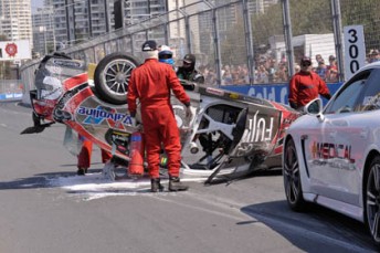 Ricky Taylor emerges from his Fujitsu Racing wreck at the Gold Coast yesterday
