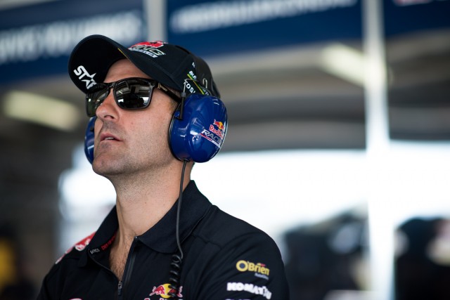 Jamie Whincup watches on while Paul Dumbrell takes to the track