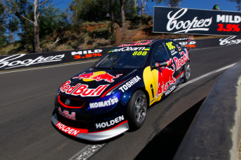 The #888 Red Bull Triple Eight Holden plunges through The Dipper