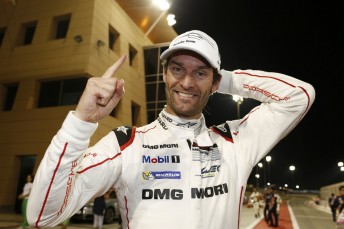 Mark Webber celebrates winning the title after a challenging race in Bahrain
