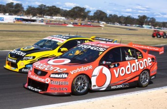 Jamie Whincup and James Moffat battled hard in the early laps