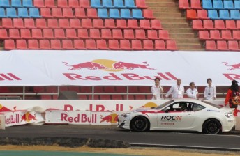 Whincup reverses out of the barriers after pushing the plastic wall into the concrete
