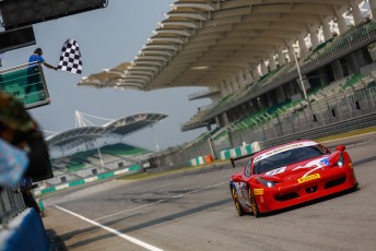 Steve Wyatt takes the chequered flag in the Ferrari Asia Pacific Challenge 