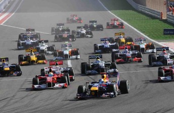 The Formula One field stream into Turn 1 in 2010