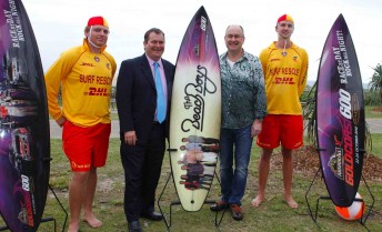 Surf Lifesavers Ashley (far left) and Bernard (far right) were on hand to help the Minister Phil Reeves and Tony Cochrane unveil the band that is all about sun, sand and surf