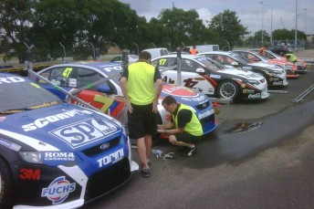 The cars queue up at Brisbane International Airport before jetting off to Abu Dhabi