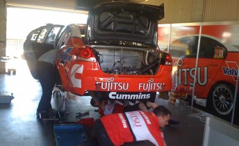 The Fujitsu Racing crew work away on changing the diffs after the first practice session