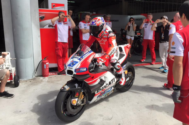 Casey Stoner aboard the GP15, complete with his famous #27