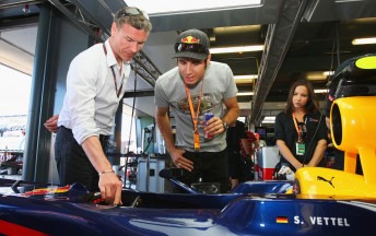 David Coulthard guides Red Bull-supported driver Rick Kelly through Sebastian Vettel