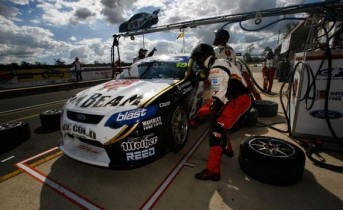 Jim beam Racing affects a pit stop on James Courtney