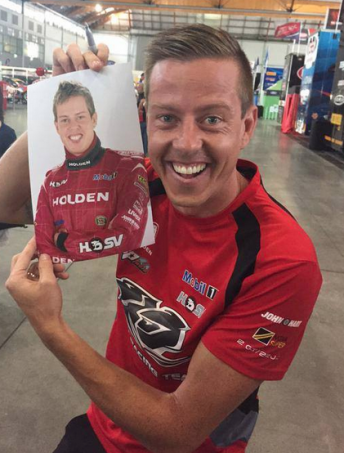 Courtney posing with a picture from his V8 Supercars debut in 2005