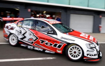 James Courtney peels out of the pit garage at The Island yesterday