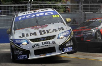 James Courtney leads Jamie Whincup at the Sydney Telstra 500 street track yesterday