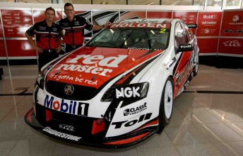 Will Davison and Garth Tander stand next to their 2010 Toll Holden Racing Team challenge