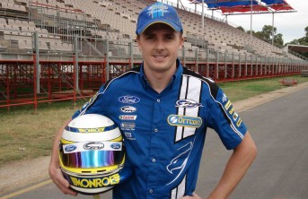 Mark Winterbottom poses with his new helmet design, featuring the colours of Monroe shock absorbers