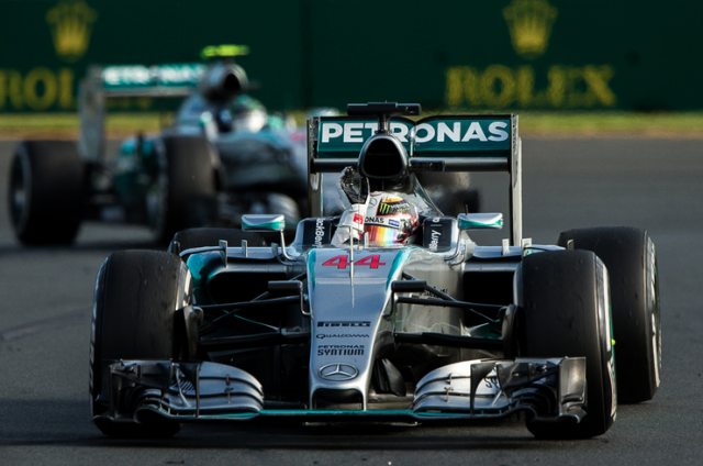 Hamilton celebrates ahead of team-mate Rosberg