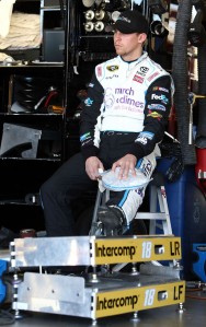 Denny Hamlin ices his left knee during practice in Phoenix. Hamlin is racing after knee surgery for a torn ACL last week