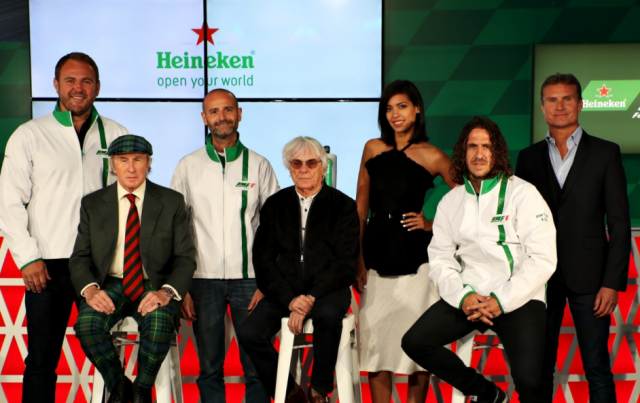 Ecclestone flanked by Heineken bosses and ambassadors at the launch