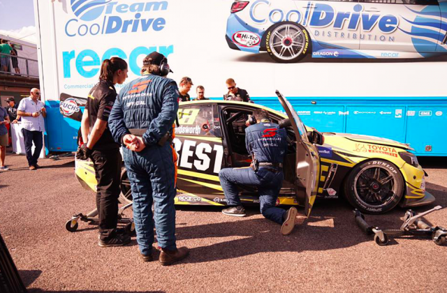 Supercars officials inspect the roll-cage
