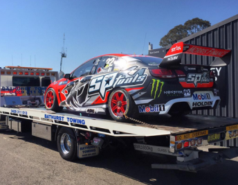 The #22 Commodore returning to the paddock on a tilt tray. pic: @v8supercars