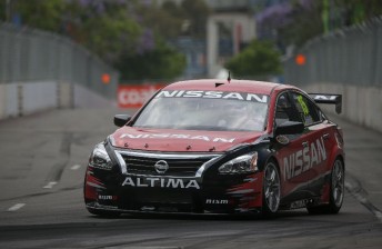 thum Rick Kelly cut his first laps in the Altima, albeit at a reduced pace