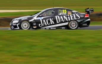 Rick Kelly will start from pole in his qualifying race at Phillip Island this afternoon