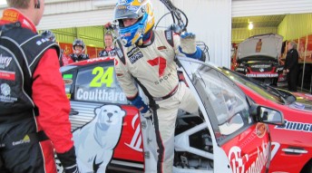 Mark Larkham leaps out of Fabian Coulthard