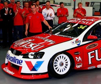 Lee Holdsworth helps unveil the Fujitsu livery last month. Next year, he is likely to have his own new car to compete in