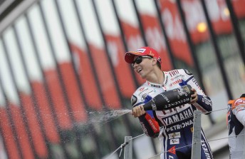 Spanish rider Jorge Lorenzo celebrates on the British GP podium 