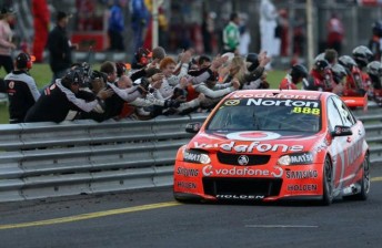 The #888 Holden taking the chequered flag