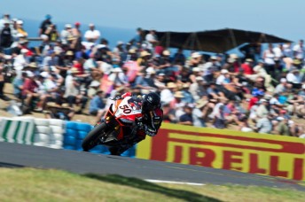 Sylvain Guintoliled an  Aprilia podium sweep in the opening race at Phillip Island