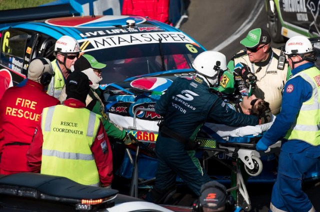 Mostert in the hands of medical crews at the crash scene