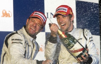 Rubens Barrichello and Jenson Button celebrate on last year