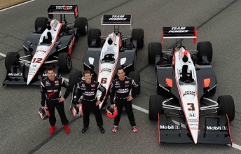 thumb Will Power, Ryan Briscoe and Helio Castroneves pose with their respective Team Penske race cars