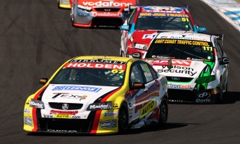 Tim Slade leads Fabian Coulthard at The Island 300 yesterday