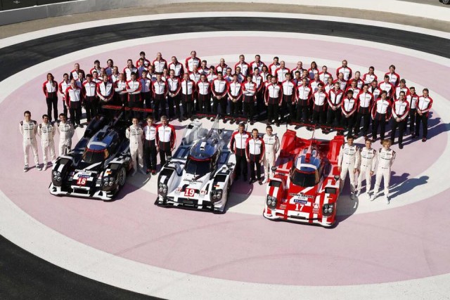 Jeromy Moore (furthest right in the front-row of the crew) with the Porsche team