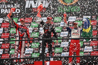 Will Power celebrates on the podium after his victory in Brazil today