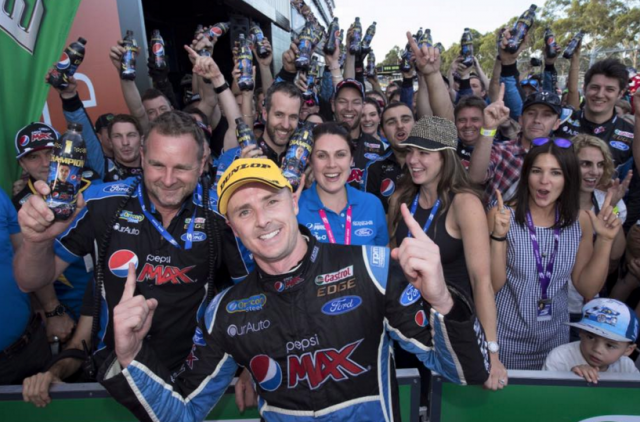 Winterbottom and Edwards celebrate with the Prodrive team