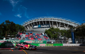 Jamie Whincup passes by the ANZ Stadium during the Sydney 500