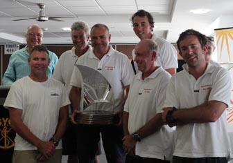 car Dane (centre) holding the trophy from the recent Sail Paradise regatta
