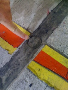 The silicon-filled expansion joint that the air jack on Tander