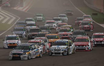 The V8 Supercars swarm into turn one for the start of Race 4 at the Bahrain International Circuit on the weekend