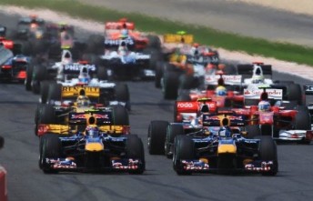Mark Webber and Sebastian Vettel jostle into turn one at the start of the British Grand Prix last weekend